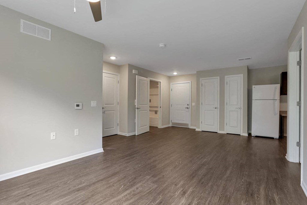 the living room and kitchen of a new home with a renovated floor plan