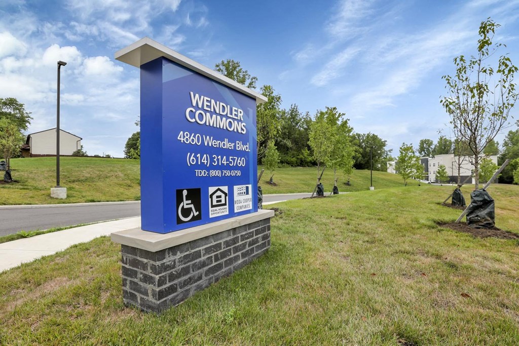 a sign for weider comforts on the side of a road