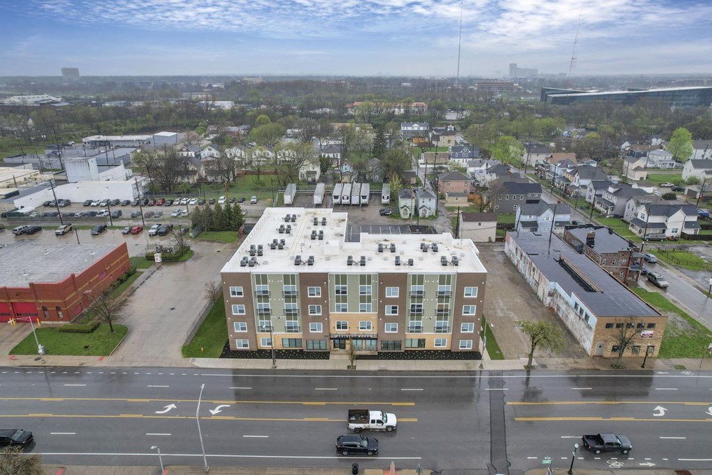 an aerial view of an apartment building in a city