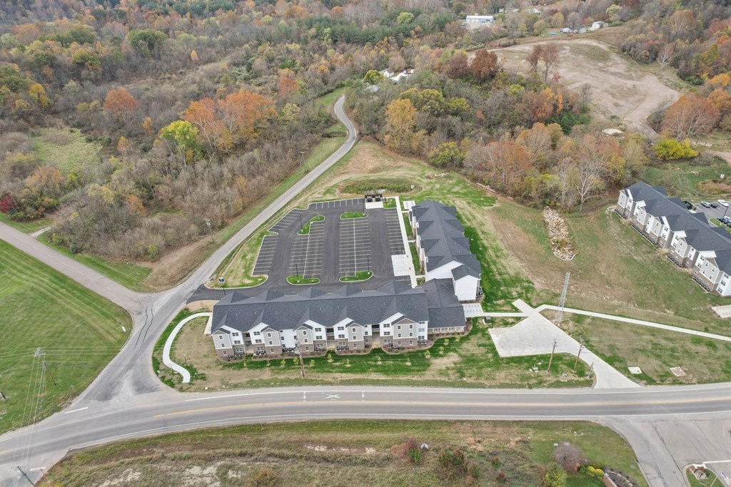 a view of a building from the air with a road