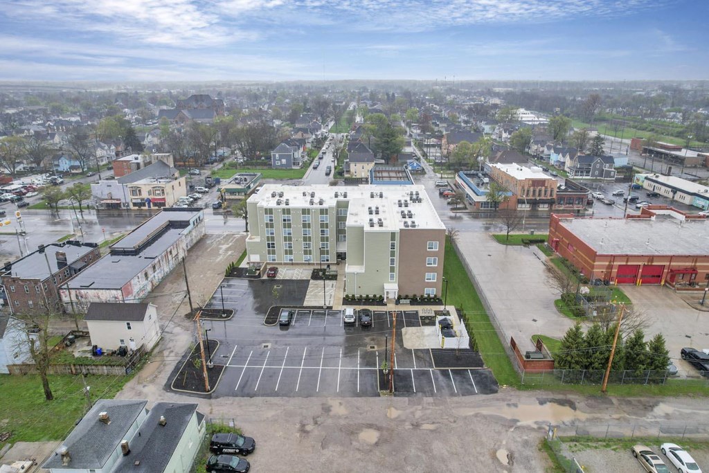 an aerial view of an empty parking lot in a city