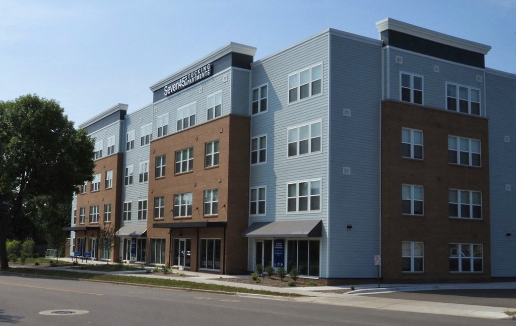 a row of new apartment buildings on a city street