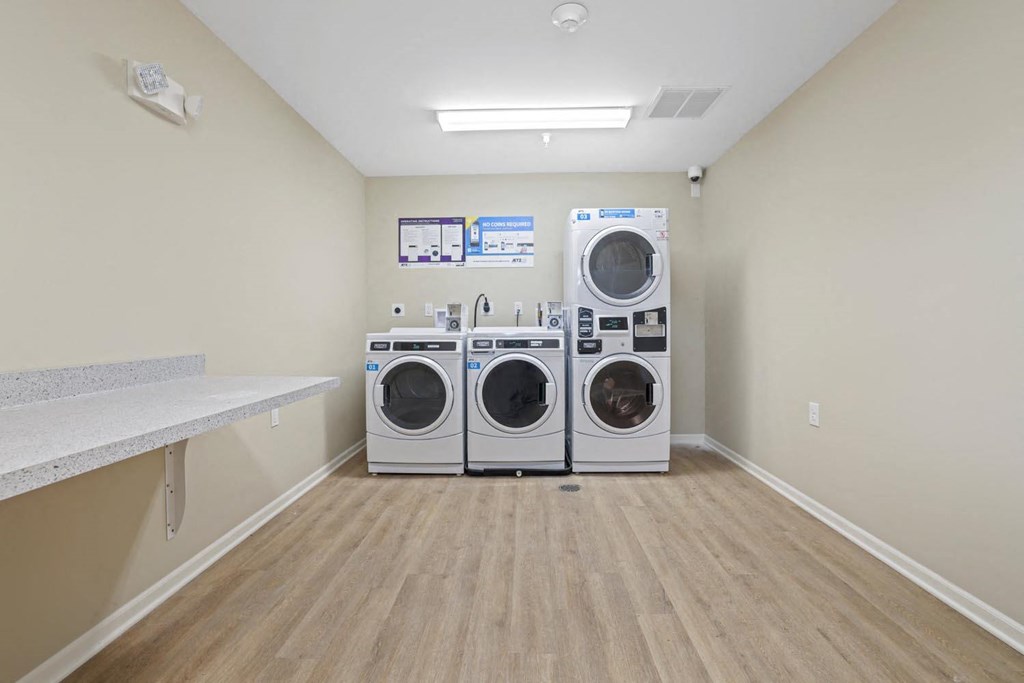 a washer and dryer in a laundry room with a counter