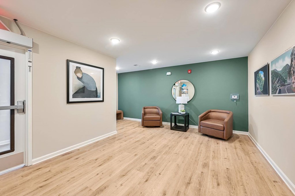 A room with a green wall and a white door.