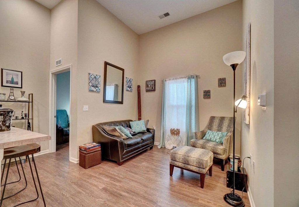 a living room with a couch and two chairs