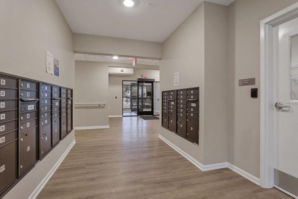 a room with a bunch of mailboxes and a door