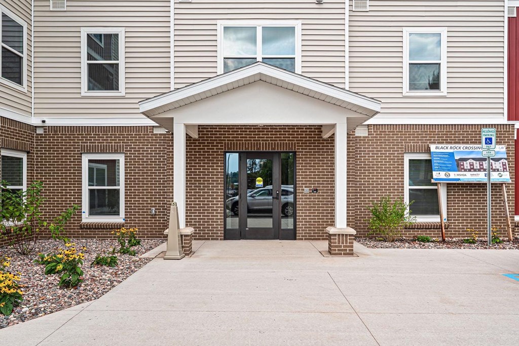 The front of a building with a sign that says Black Rose on it.