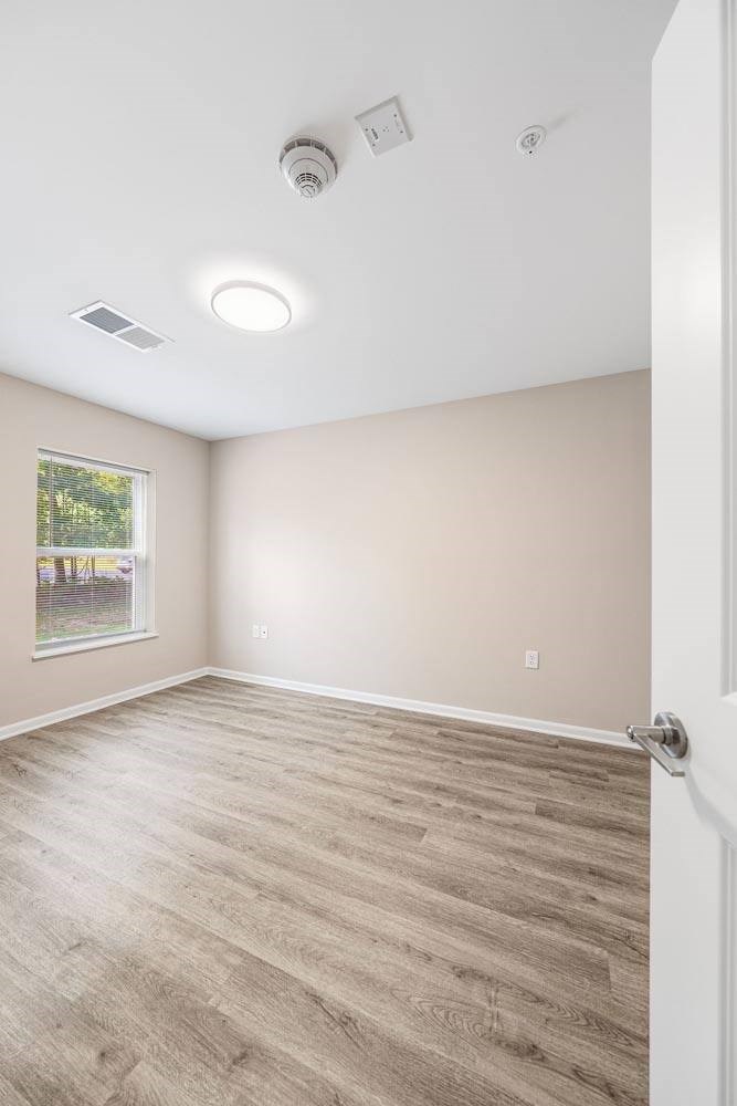 A room with a door and a window.