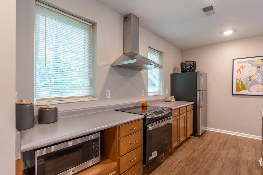 a kitchen with a stove and a refrigerator