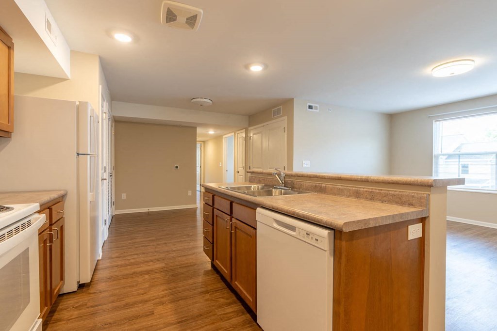 a kitchen with a sink and a refrigerator
