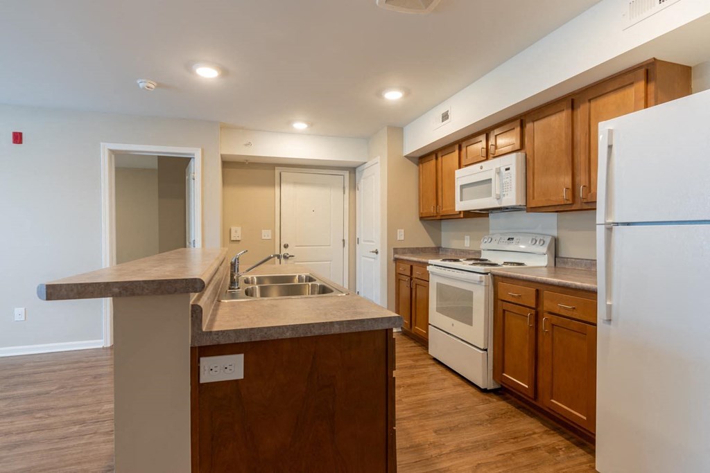 a kitchen with a sink and a refrigerator