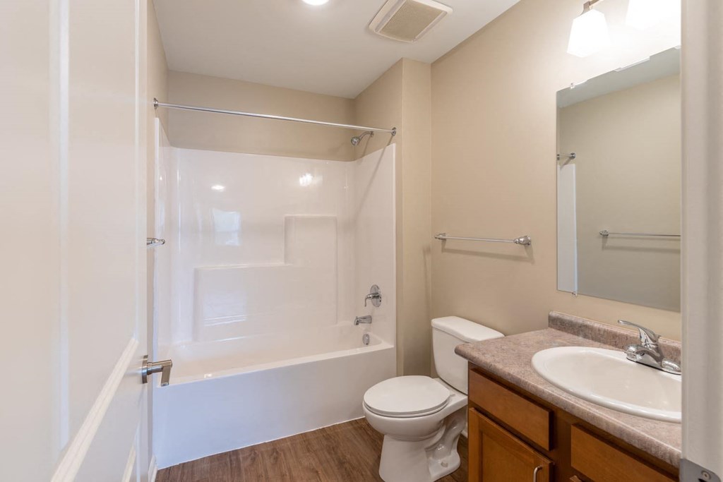 a bathroom with a sink toilet and a shower