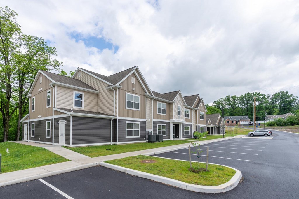 a row of houses on the side of a street