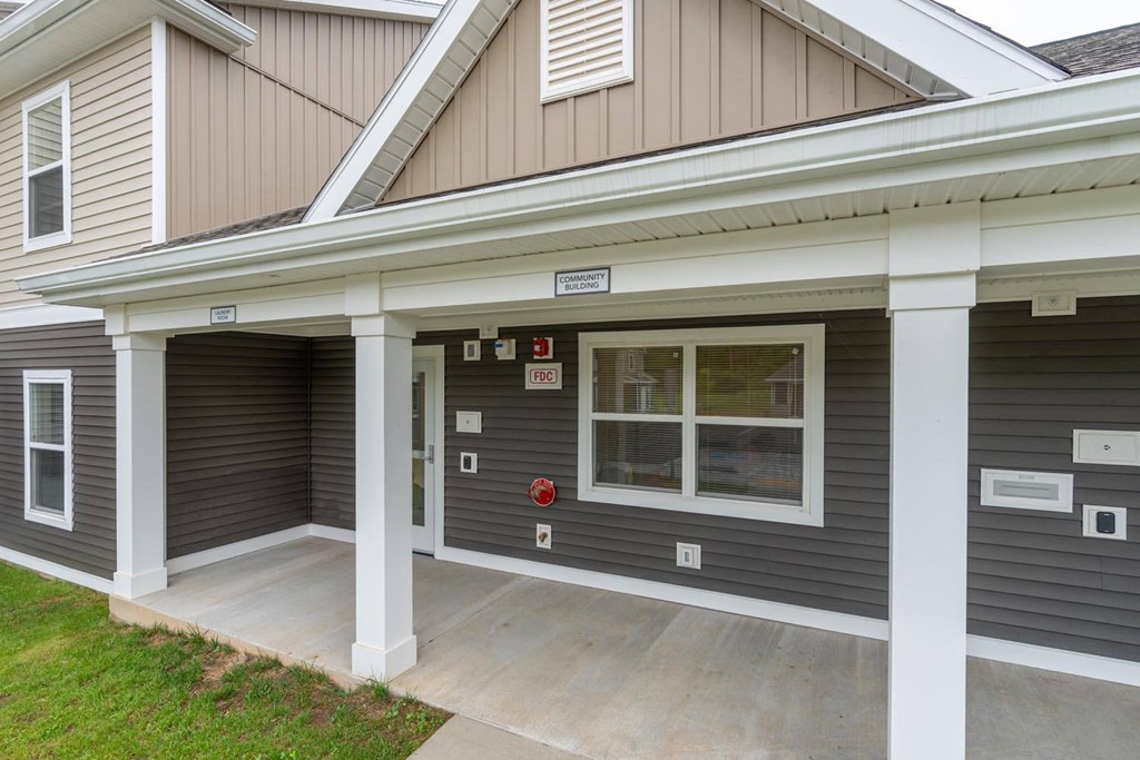 the front of a house with a driveway and a garage door