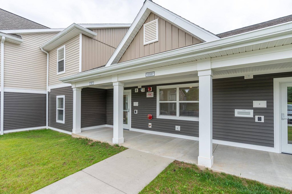 a garage with two roll up doors on the side of a building