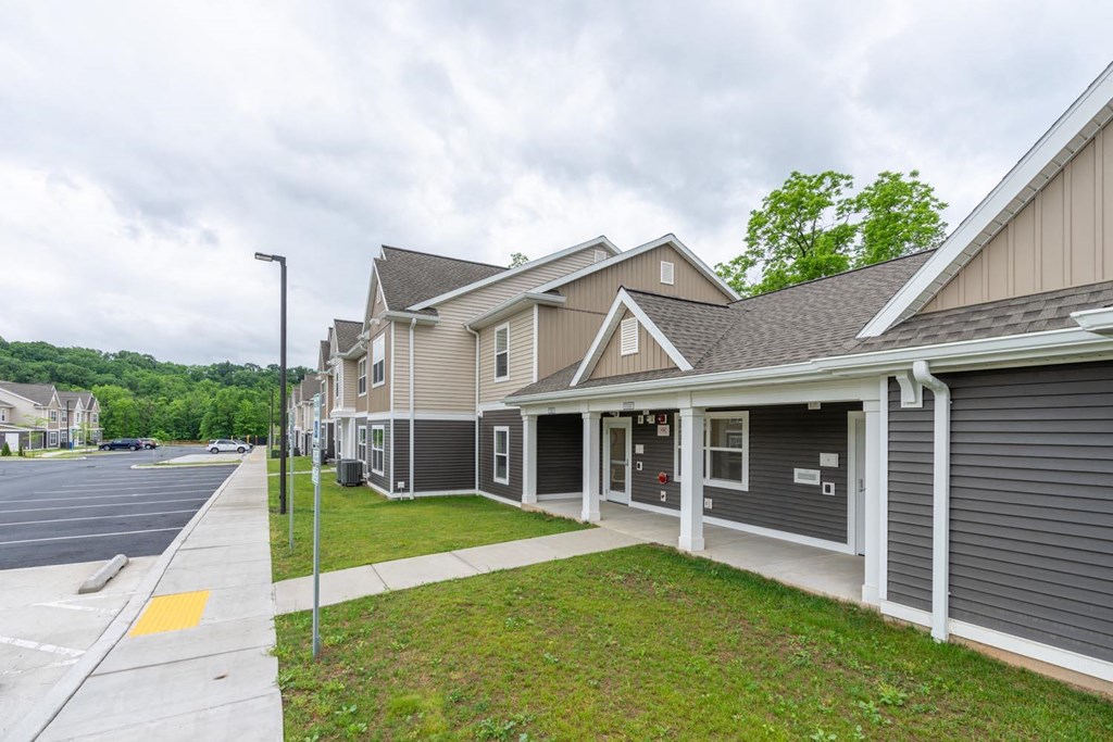 a row of houses on the side of a street