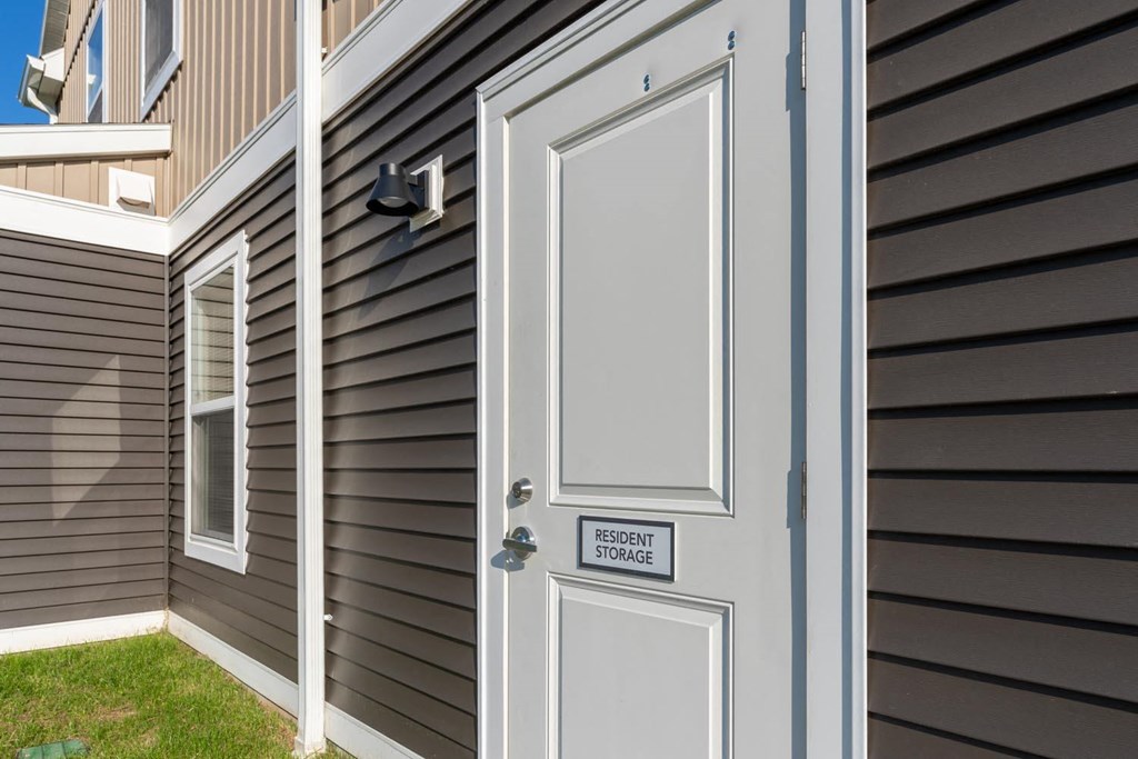 a gray door on the side of a house