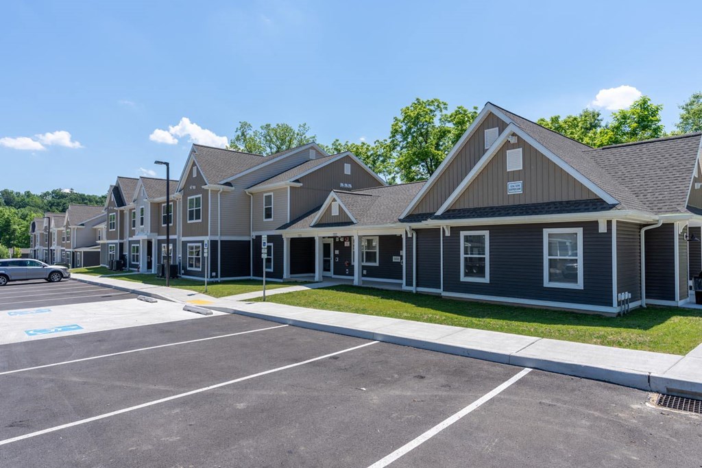 a row of houses with a parking lot