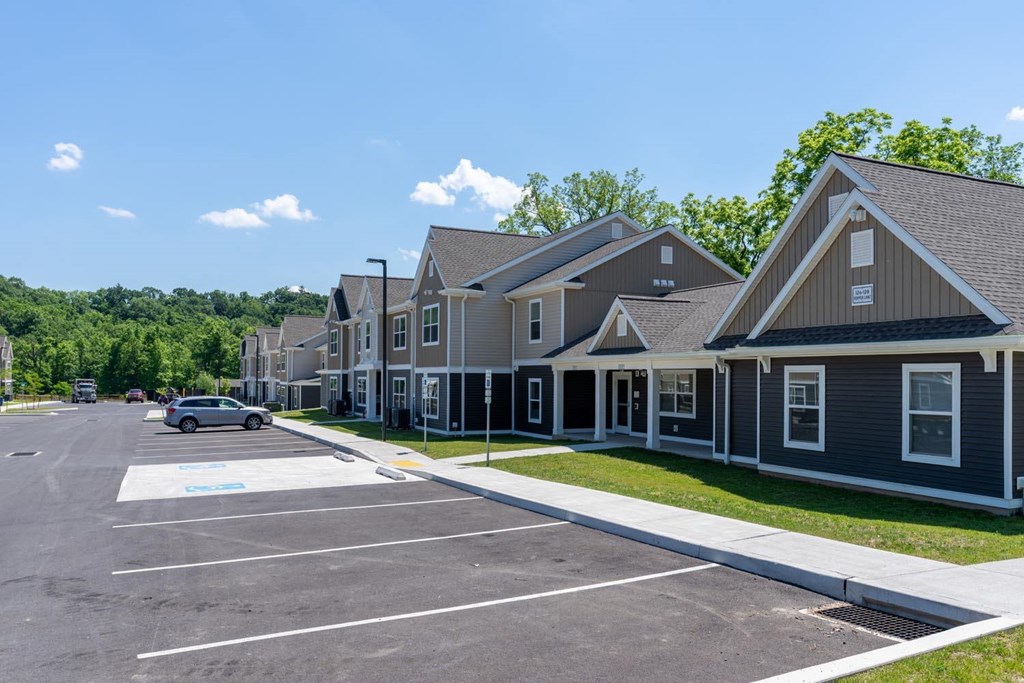 a row of houses with a parking lot