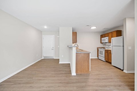 a kitchen with an island and a white refrigerator