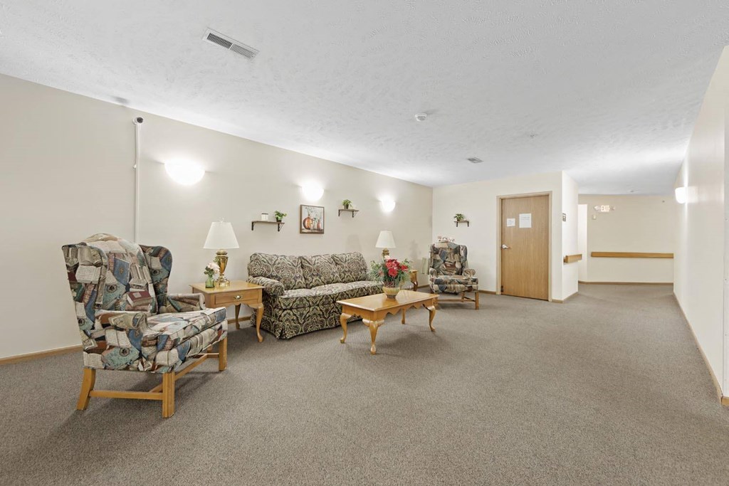 a living room filled with furniture and a door