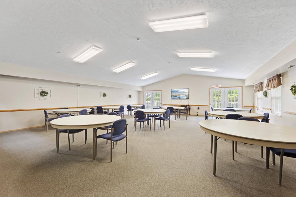 a room filled with tables and chairs and tables