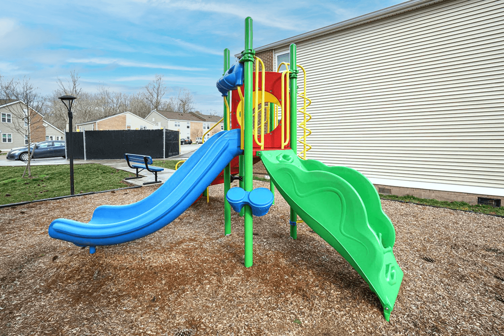 the playground at the preserve at polk apartments with slides