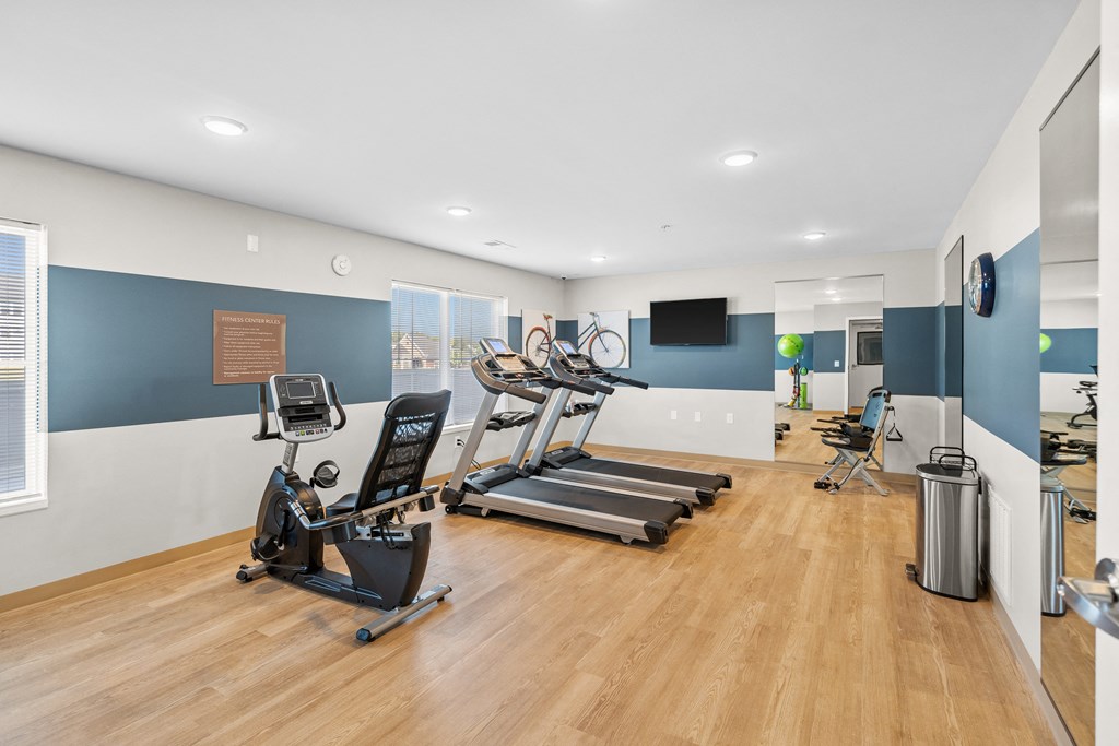 the gym with treadmills and other exercise equipment at the flats at west end