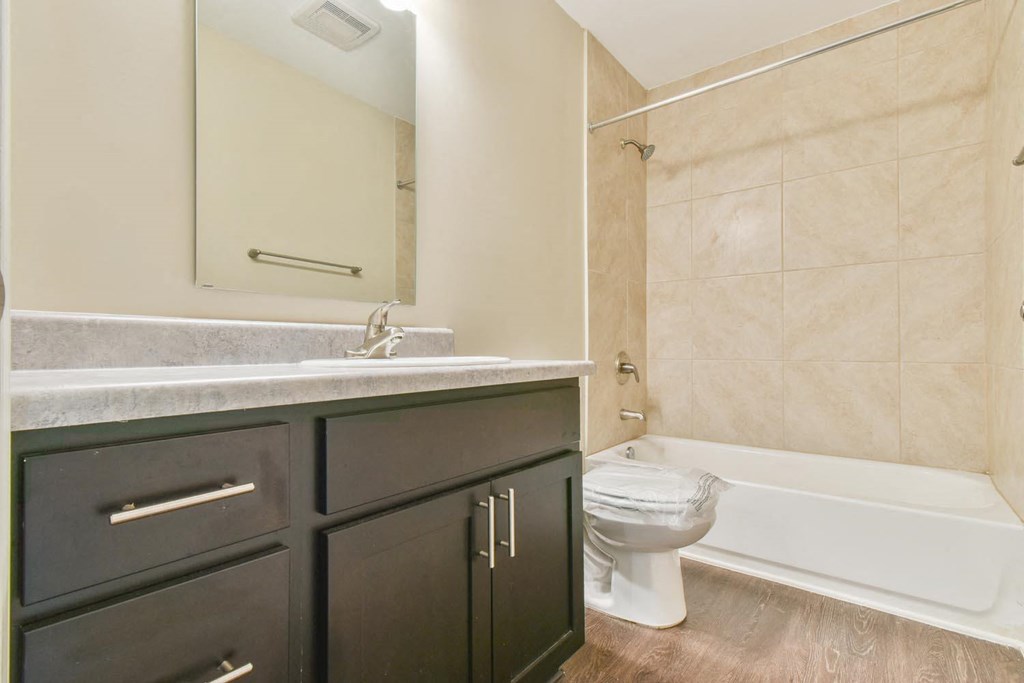 a bathroom with a toilet sink and bathtub