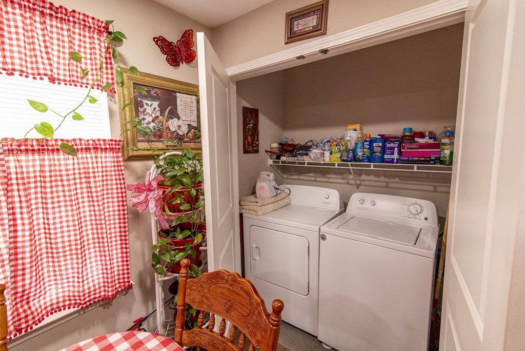 a laundry room with a washer and dryer
