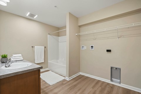 A bathroom with a sink, toilet, and a walk-in shower.