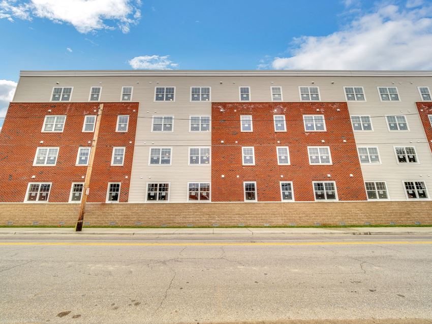 an apartment building on the side of a street
