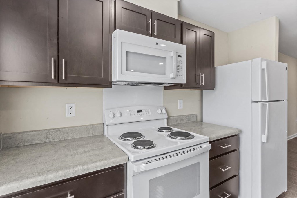 a kitchen with a stove microwave and refrigerator