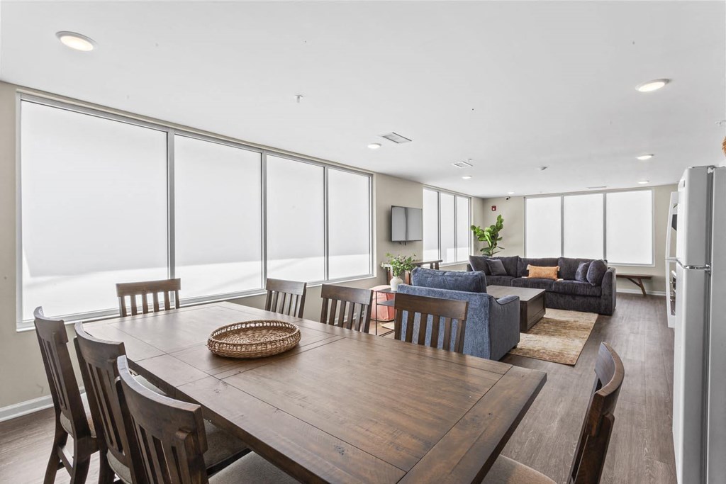 a living room with a wooden table and a couch