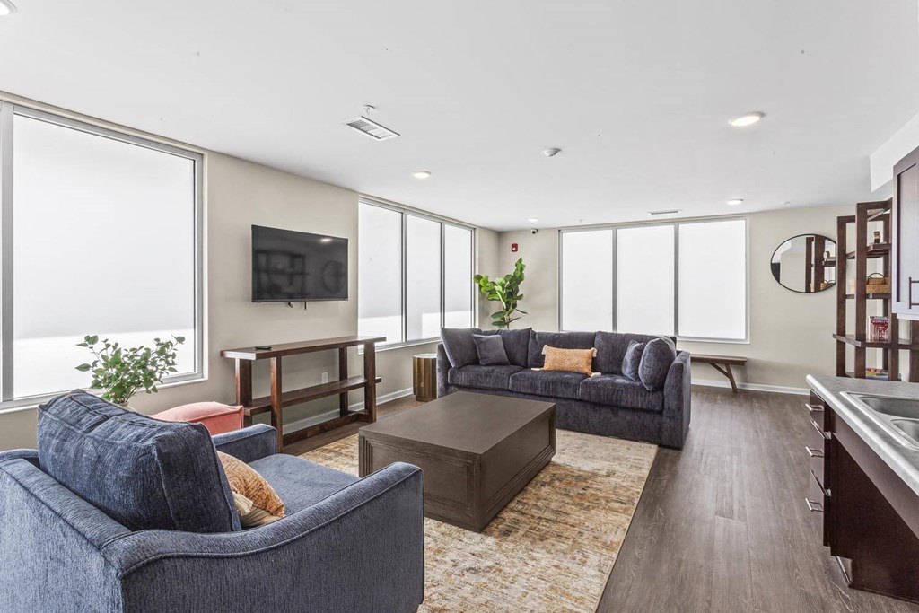 a living room with couches and a coffee table