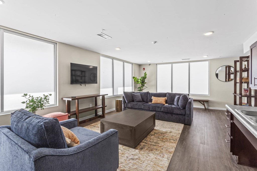 a living room with couches and a coffee table