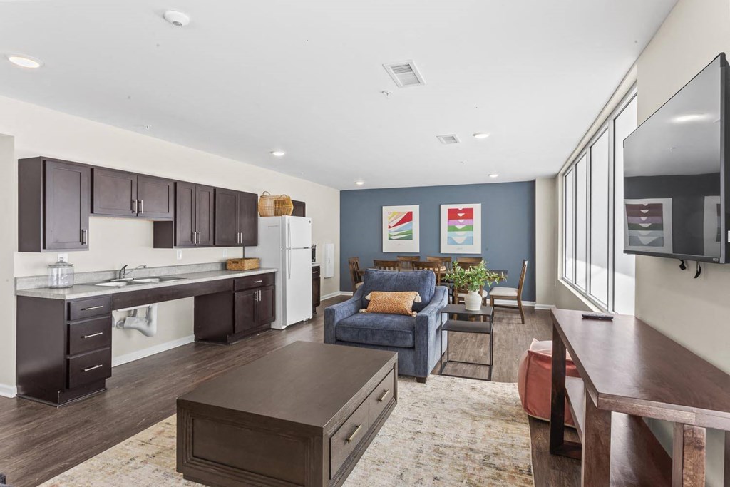 a living room with a kitchen and a dining room