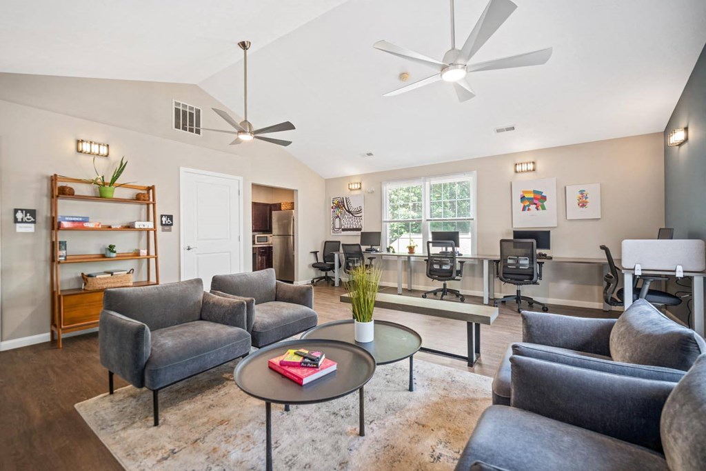 a living room with couches and chairs and a coffee table
