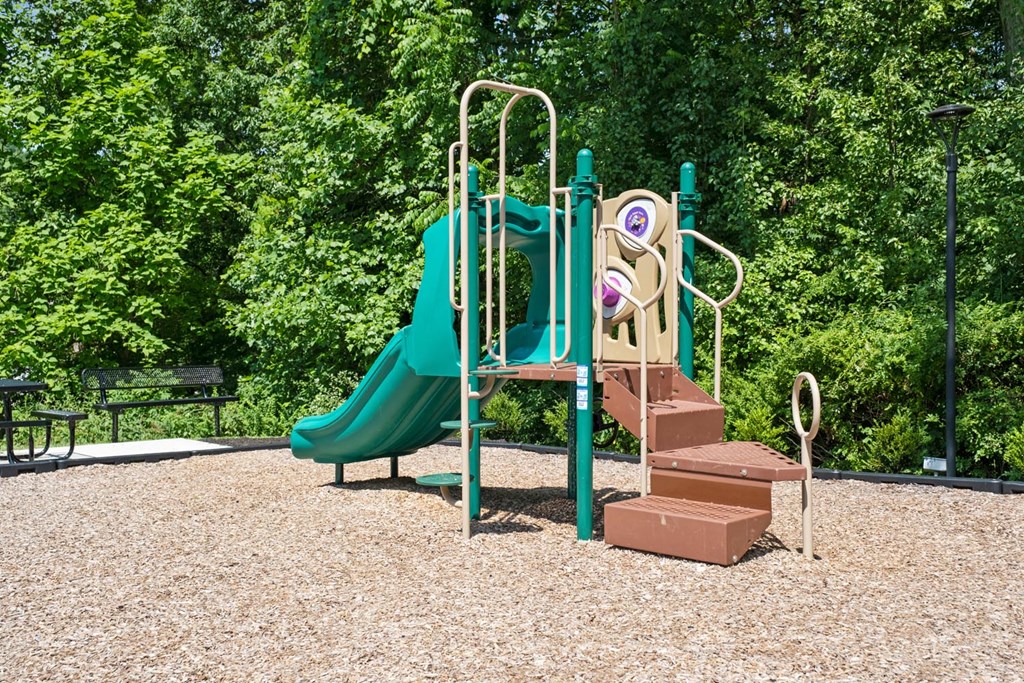 a playground with a slide and stairs