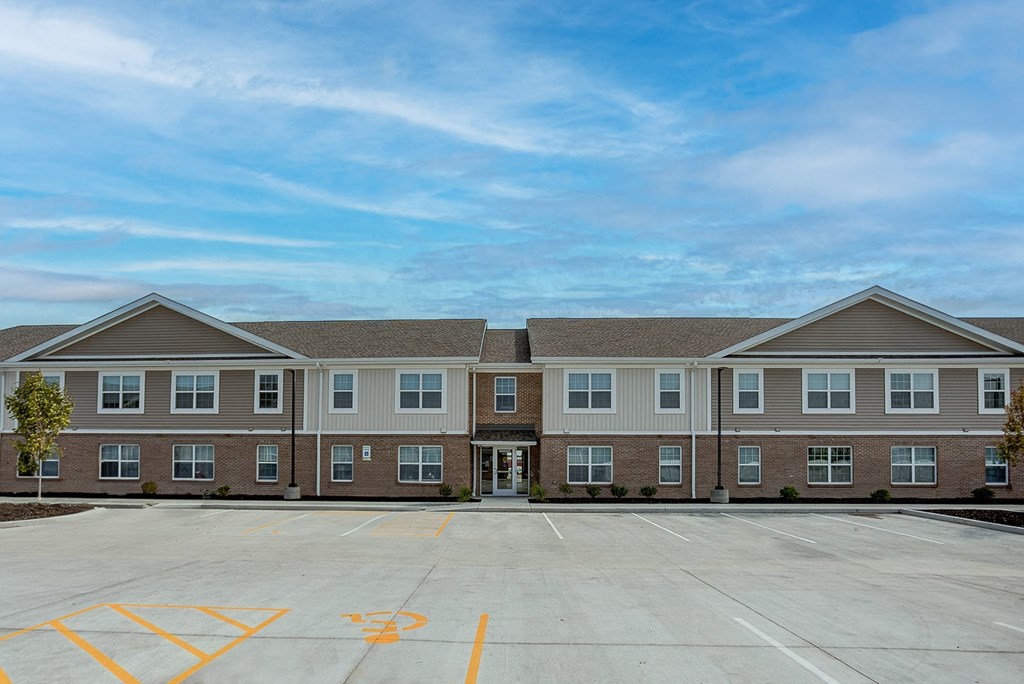 the outlook of a building with a parking lot