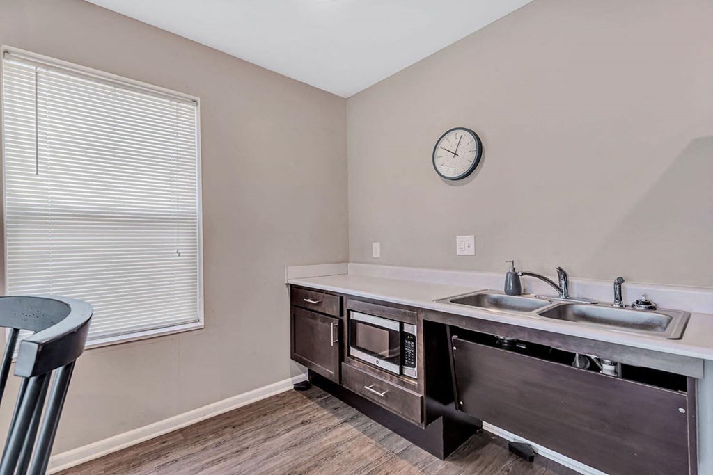 a kitchen with a sink and a window