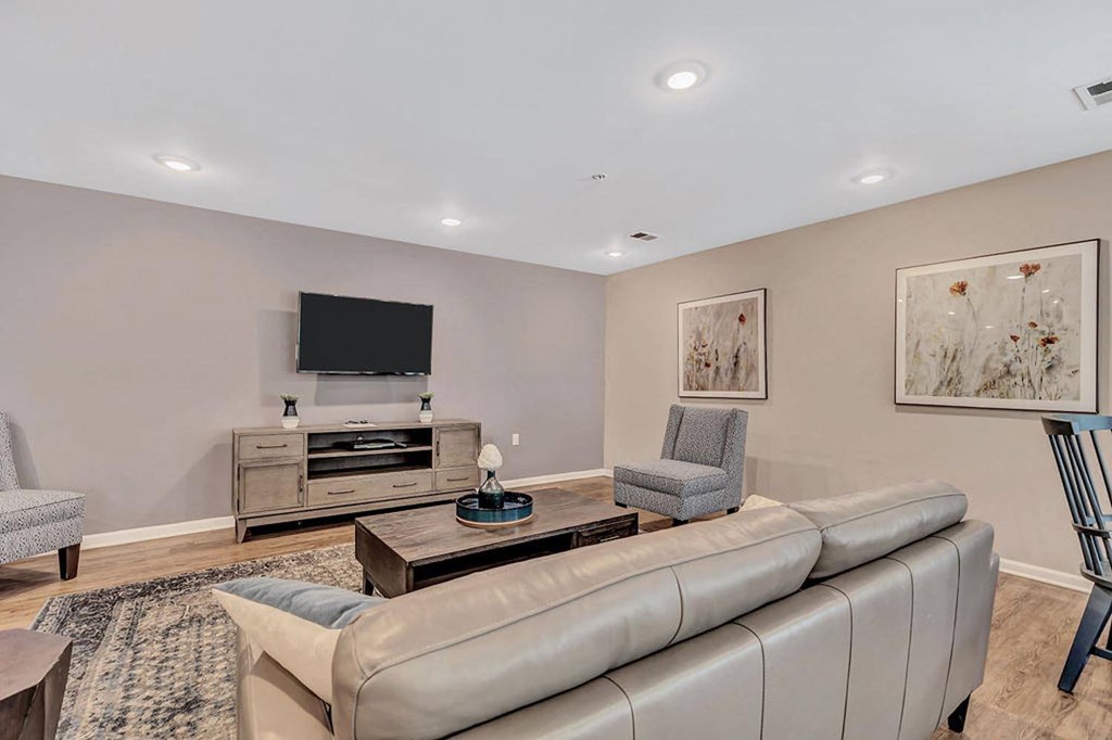 a living room with a couch and two chairs