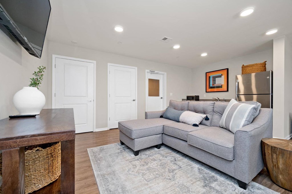 a living room with a couch and a tv