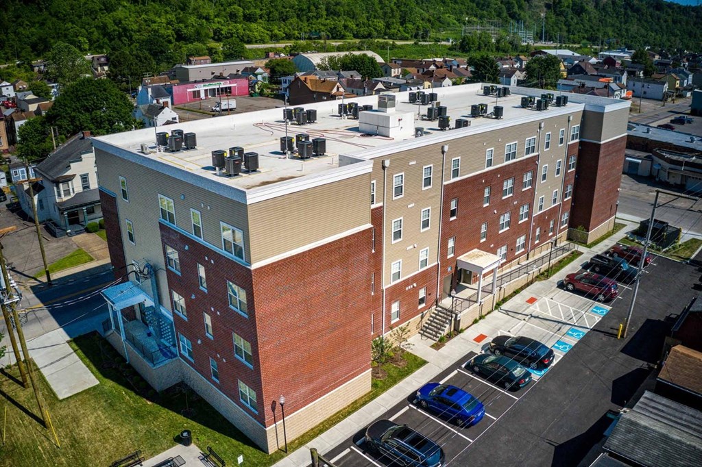 a large brick building with a white roof