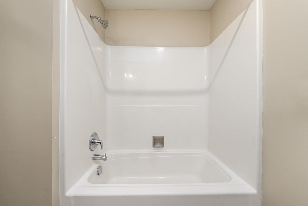 A white bathroom sink with a silver faucet.