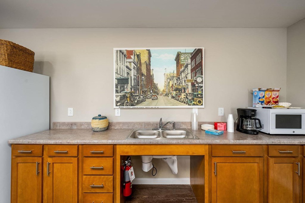 a kitchen with a sink and a microwave