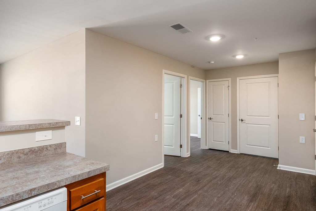 a bedroom with a medium sized bed and a desk with a chair in a room