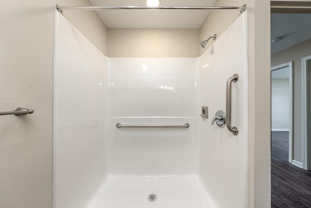 a bathroom with a shower and a sink
