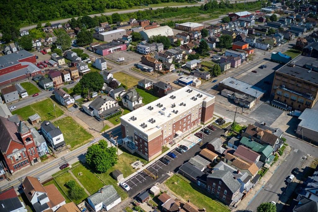 arial view of a small town with a large building in the middle