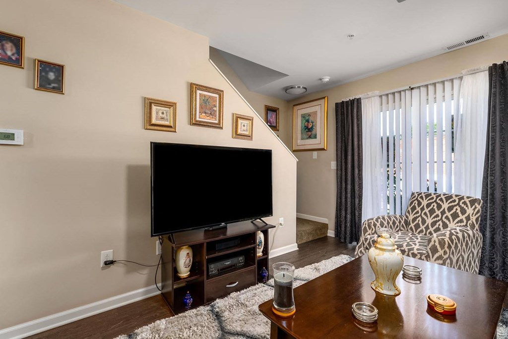 a living room with a couch and a tv